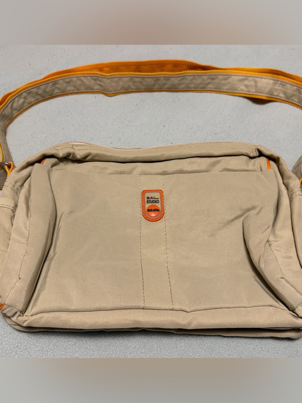 Bay Studio Beige Messenger Bag with Orange Accent Strap